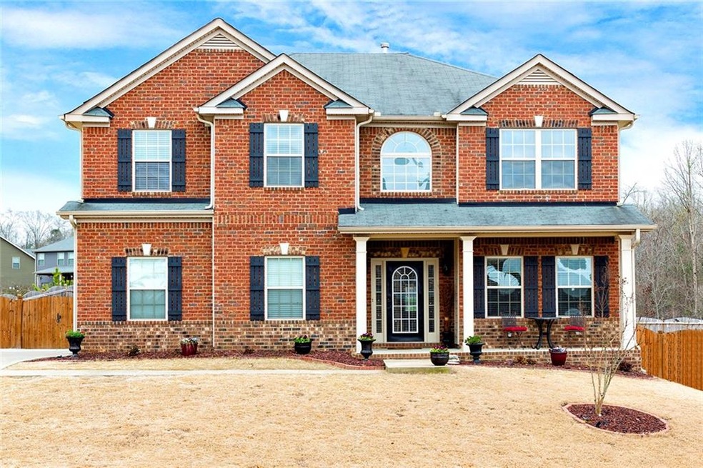 This home has great curb appeal and a side entry g