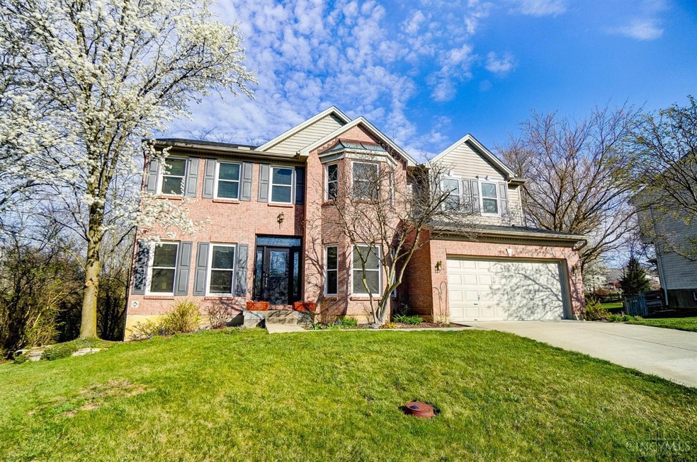 Welcome to 6392 Hughes Glen Ct! A two-level house with an attached two car garage with driveway and street parking.