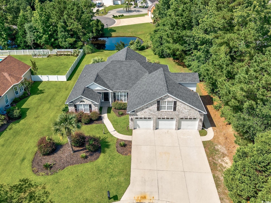 View of front of house with fence, stone siding, concrete driveway, a garage, and a front lawn