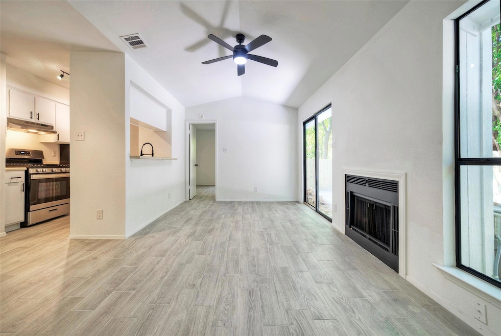 Unfurnished living room featuring a fireplace, a 