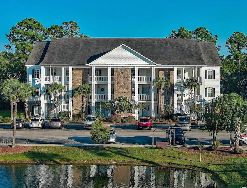 View of property with a water view