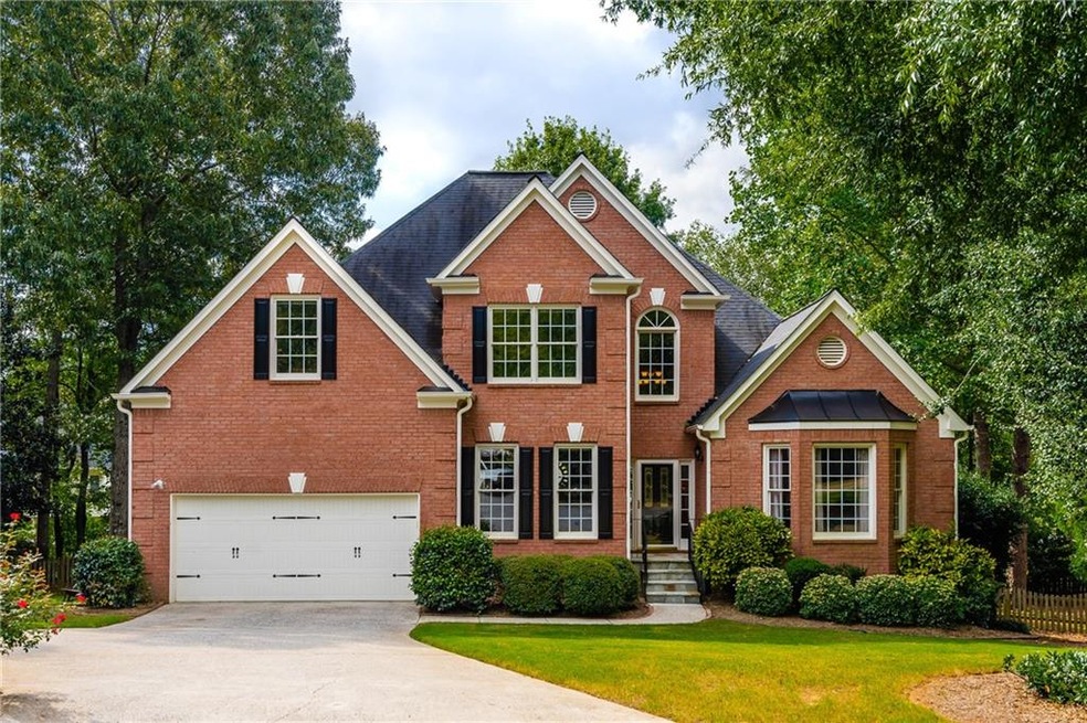 Brick beauty on cul-de-sac with large, 1/3 acre fl