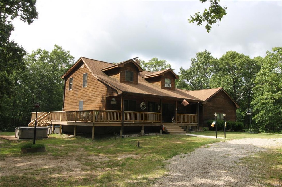 Beautiful Rustic House on 30 Acres with a Stocked 