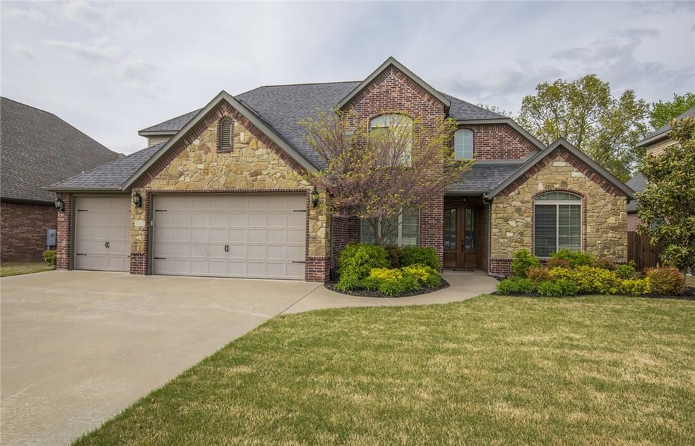 Mature trees behind home gives the feel of more space out back on the covered patio.