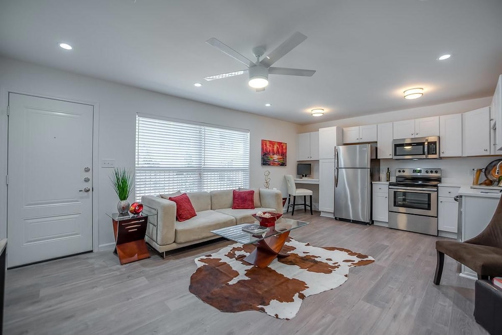 Living room featuring light hardwood / wood-style 