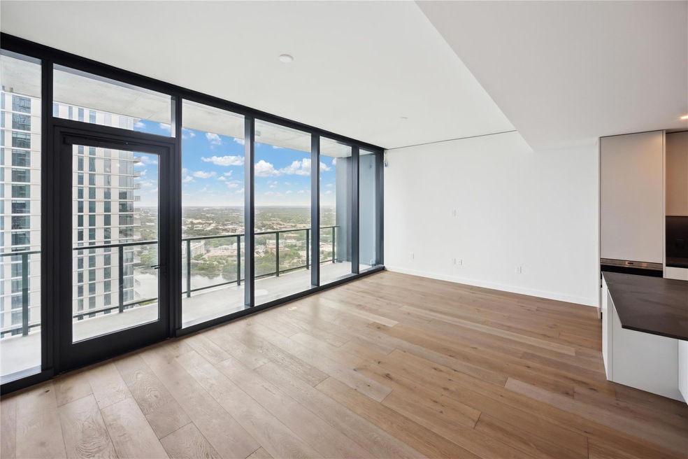 Unfurnished room featuring floor to ceiling windo