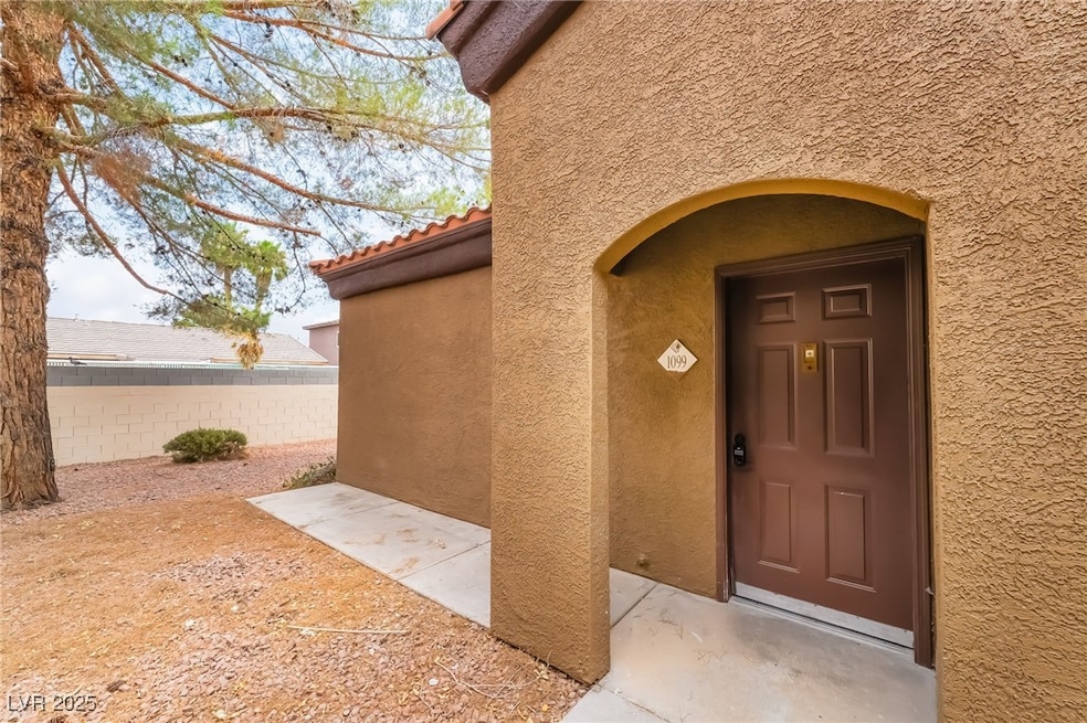 View of exterior entry featuring stucco siding