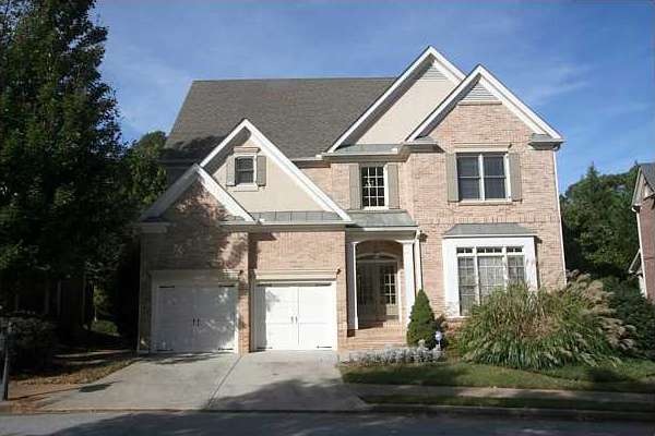 Exterior Front. 3 Sides brick with open floor plan