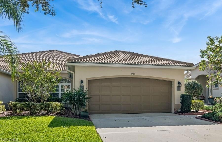 Mediterranean / spanish house with a garage and a 