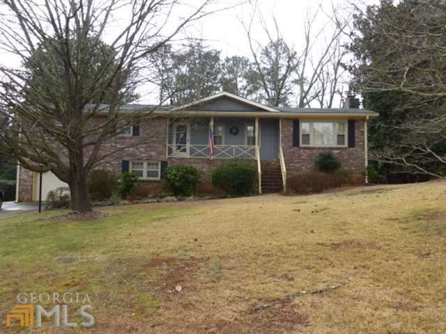 4 Sided brick ranch on a basement with a one car g