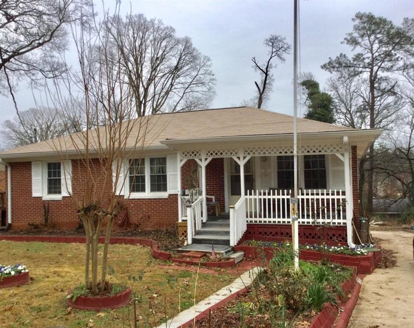 Great Curb Appeal! 3 sided Brick. Cozy front porch