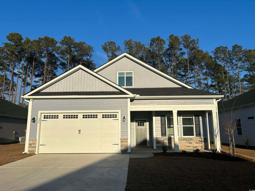 Craftsman house with a porch and a garage