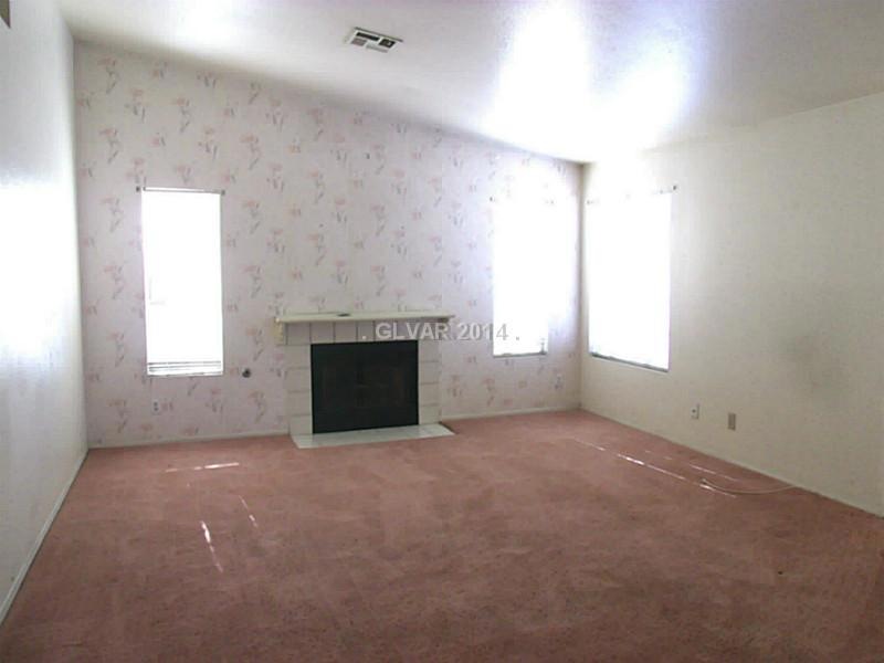 Property Photo. Living room has nice fireplace and