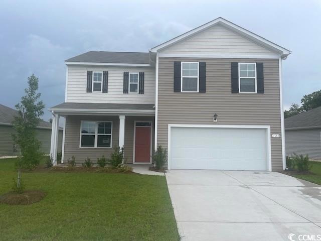 View of front facade featuring a garage and a fron