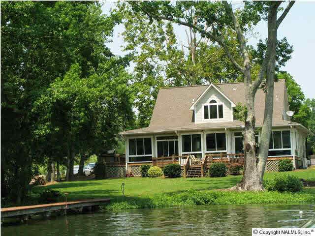 Beautiful 4BR/3BA Waterfront home Featuring 100+/-ft of Shoreline, 2 Slip Boat House with 30x8 covered deck.