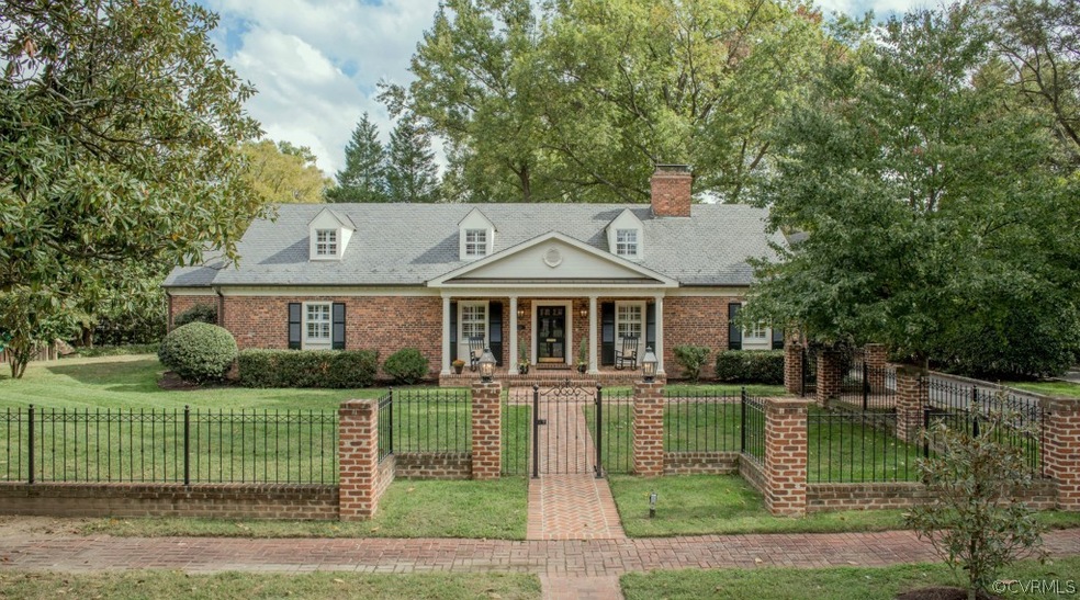 Front of the home along a beautiful Magnolia Tree-