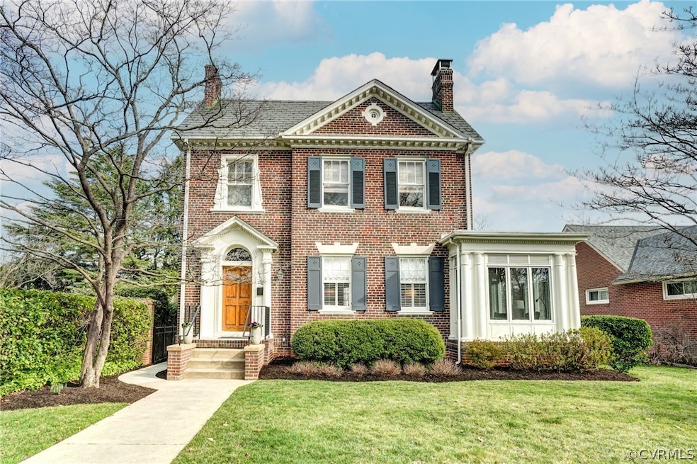 Welcome to 4112 Monument Avenue.  Classic brick and slate Colonial  on Monument Avenue