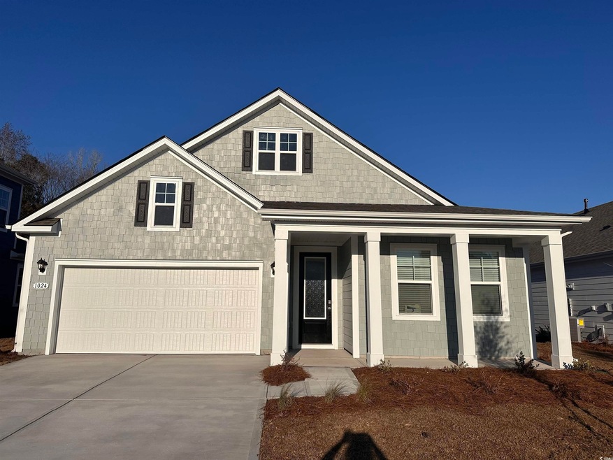 View of front of home featuring a garage