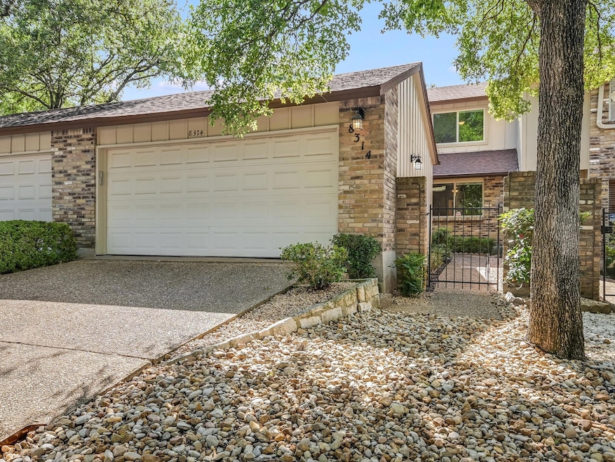View of front of home with driveway, brick siding