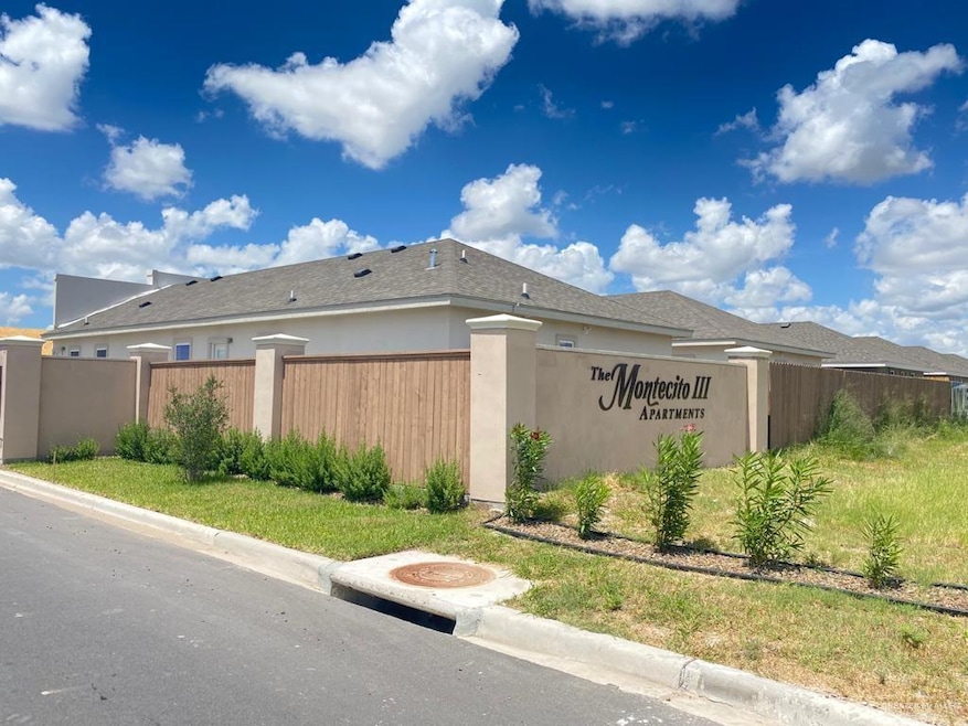 Modern home featuring stucco siding and covered parking