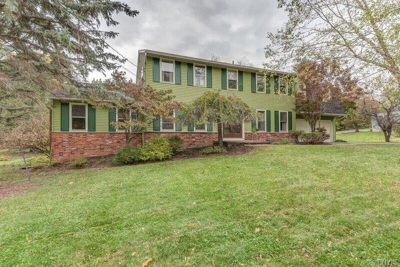 This Classic Colonial sits on an acre lot with mat