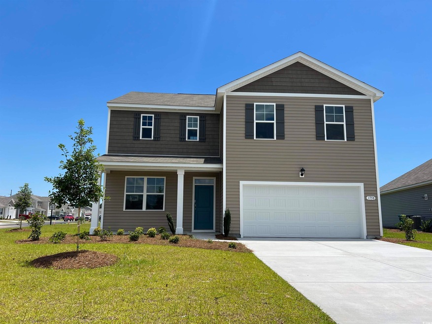 View of front of house featuring a garage and a fr