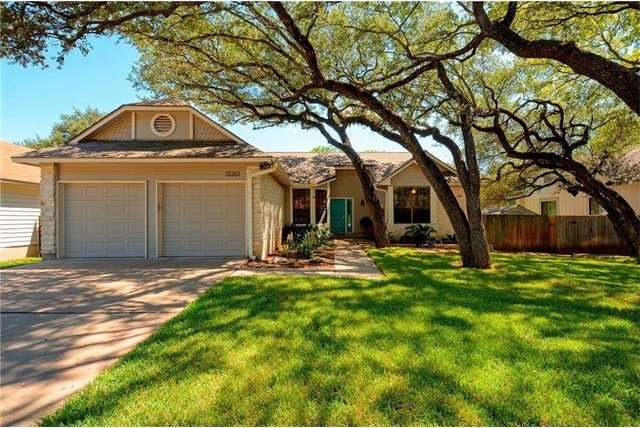 Front yard with mature trees.