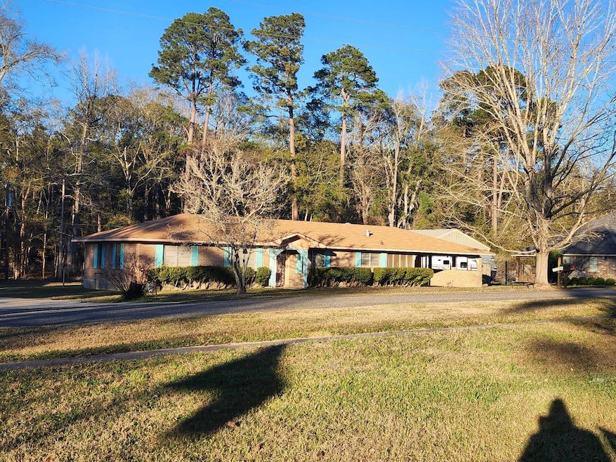 Single story home featuring a front yard