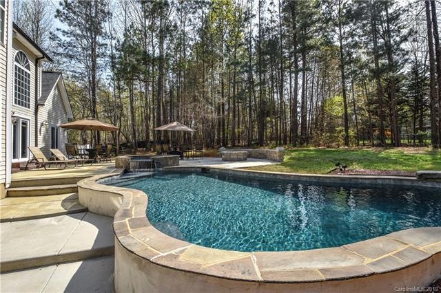 Owners added a larger concrete deck for fire pit a