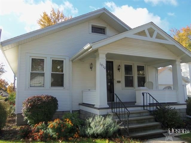 The covered front porch is perfect for relaxing.