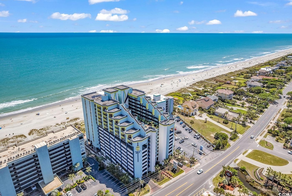 Drone / aerial view with a beach view and a water 
