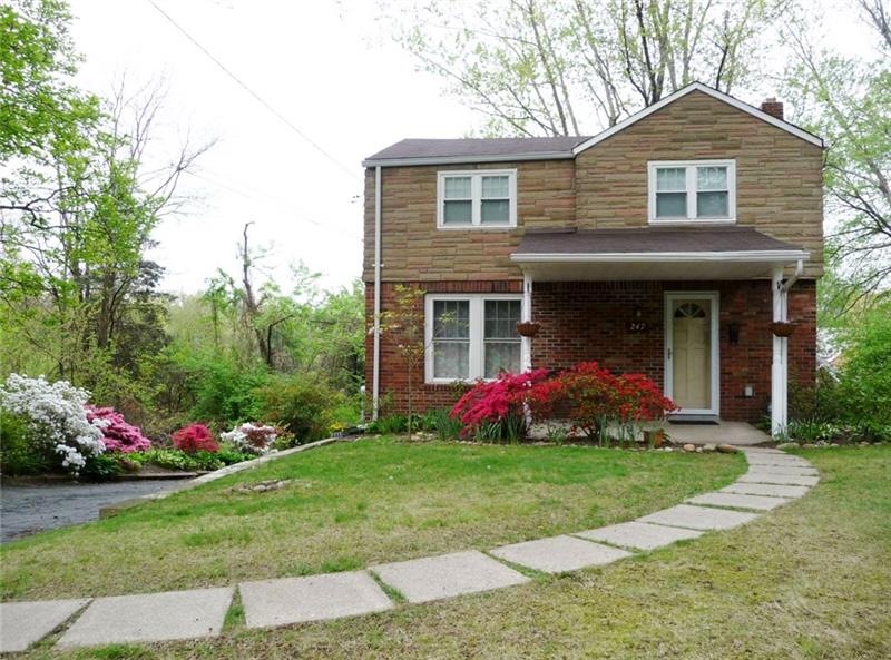 Charming home with inviting yard and front porch.