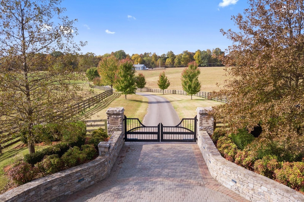  Welcome to Windswept Farm. This 40+ acre equestrian estate is nestled in the Tennessee rolling hills and offers privacy and serenity with the gorgeous stone walls, gate and four planked fences.