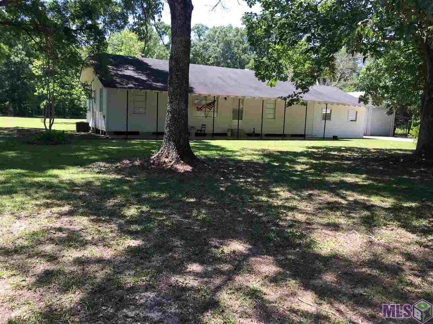 Nestled on 2 acres among Pecan, Satsuma and Oak tr