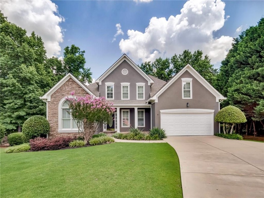 Magnificent hardcoat stucco home with stacked ston