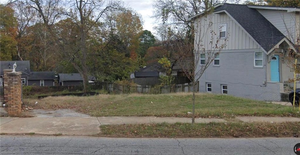 View of side of home with board and batten siding and brick siding