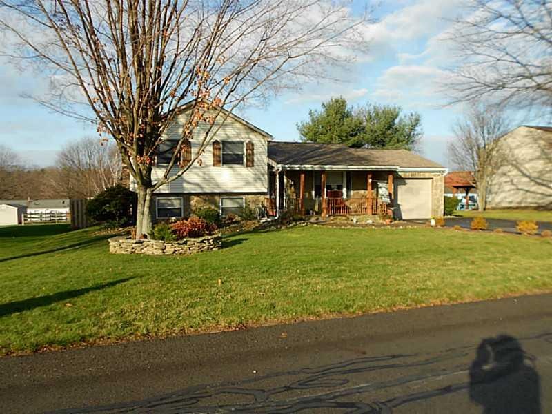 Exterior Front. Multi-level with stone front and a