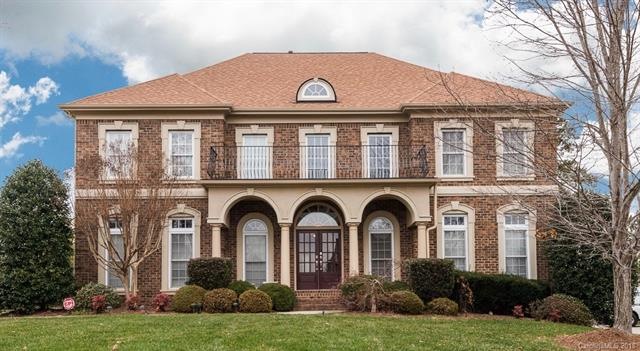 All brick home with rocking chair front porch and 