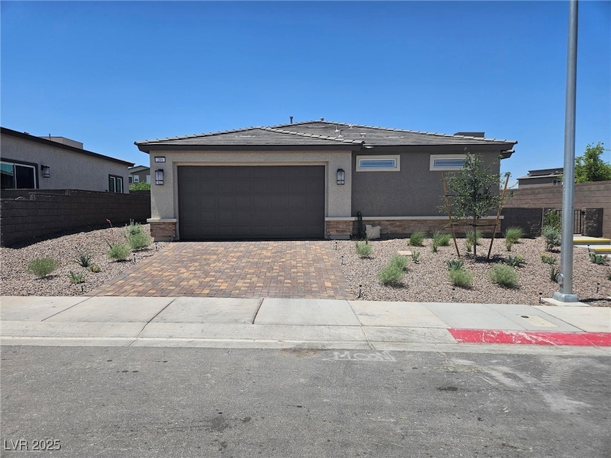 View of front of house featuring decorative drivew