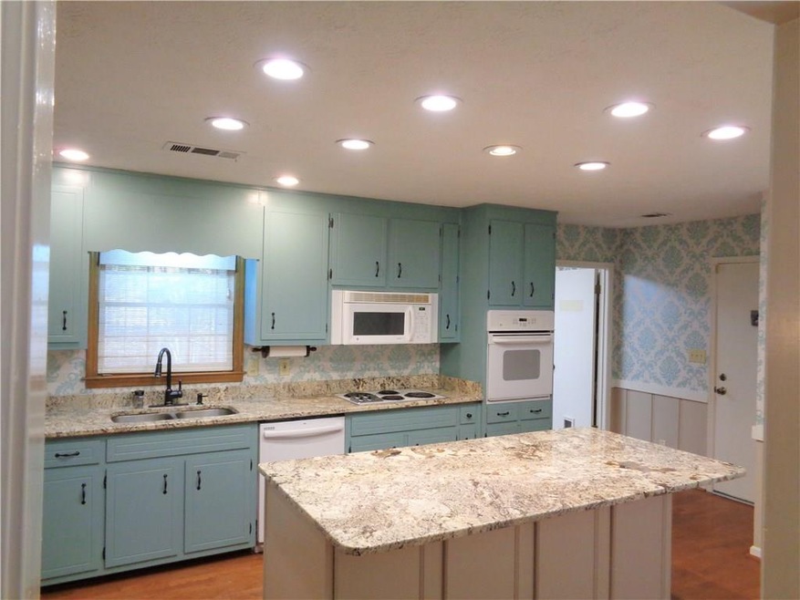Gorgeous kitchen with quartz counter tops and orga