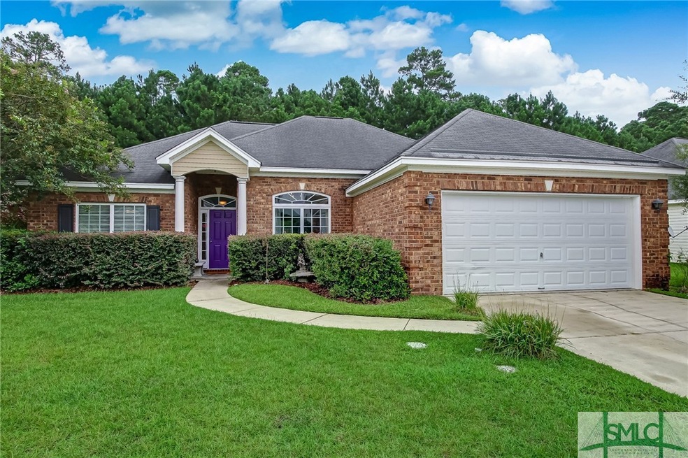 Front of the house with a two car garage.