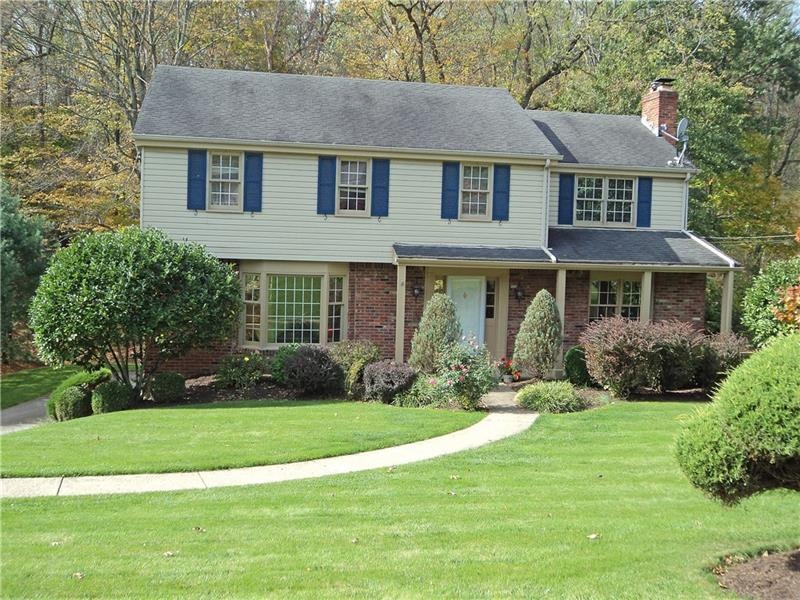 Level entry, covered porch, beautiful landscaping