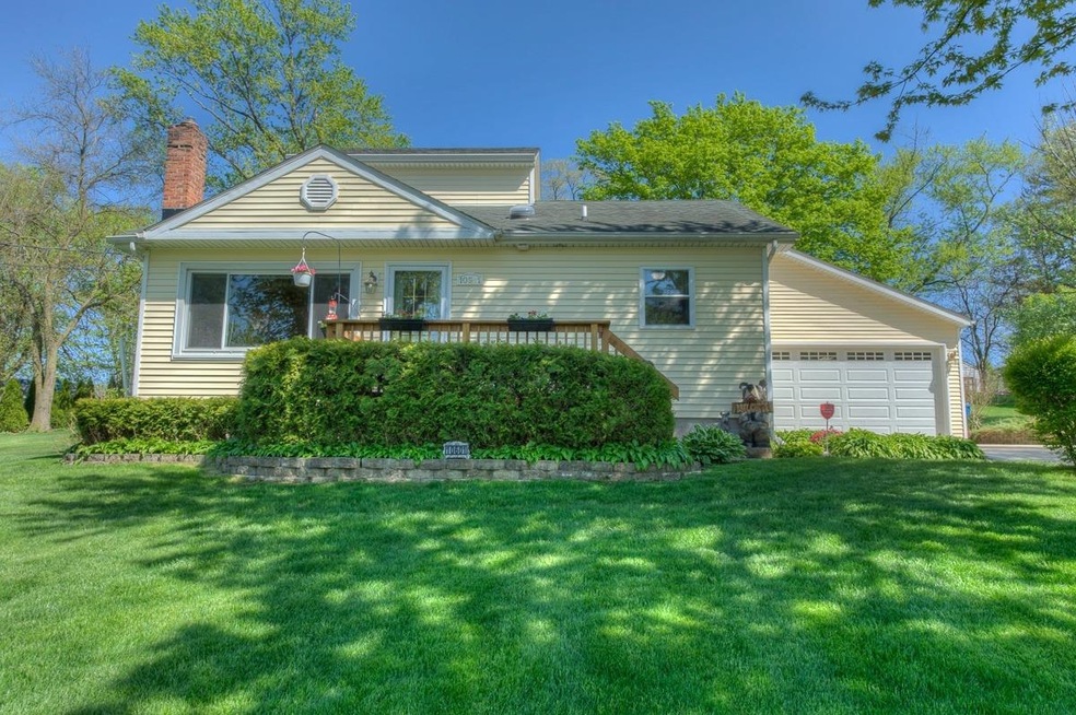 FRONT OF THE HOUSE WITH ATTACHED GARAGE