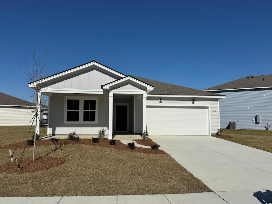 Ranch-style house featuring board and batten sidin
