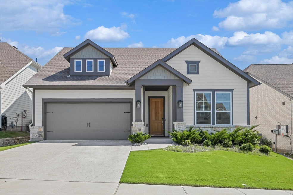 Craftsman-style home featuring a garage and a fron