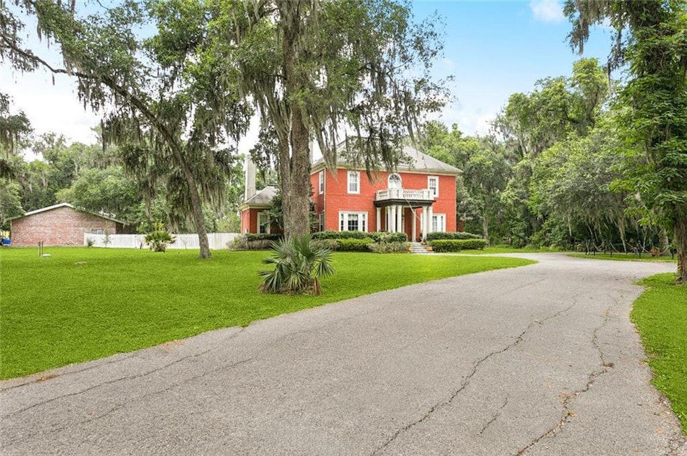 Designed to look like a historic Garden District mansion, 1 Merlin Lane was built in 2004 and features the amenities of a newer home. In addition to the beautiful architectural detail, the estate features three working gas/wood fireplaces