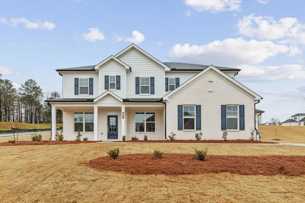 View of front of house with brick siding and cover