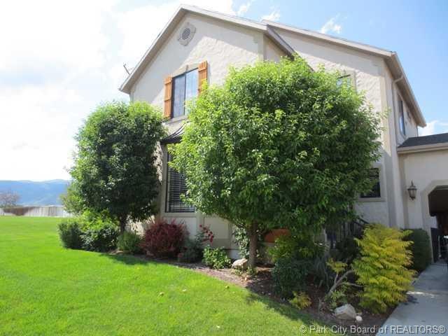 Exterior Front. Lovely mature landscapin