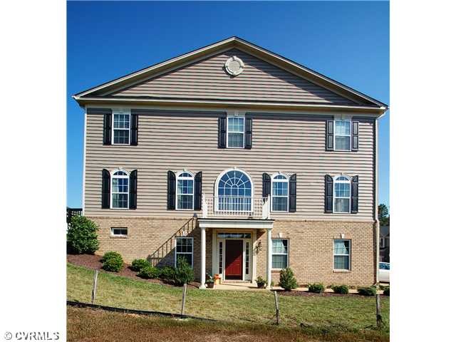 Exterior Front - This immaculate 3-story end unit 