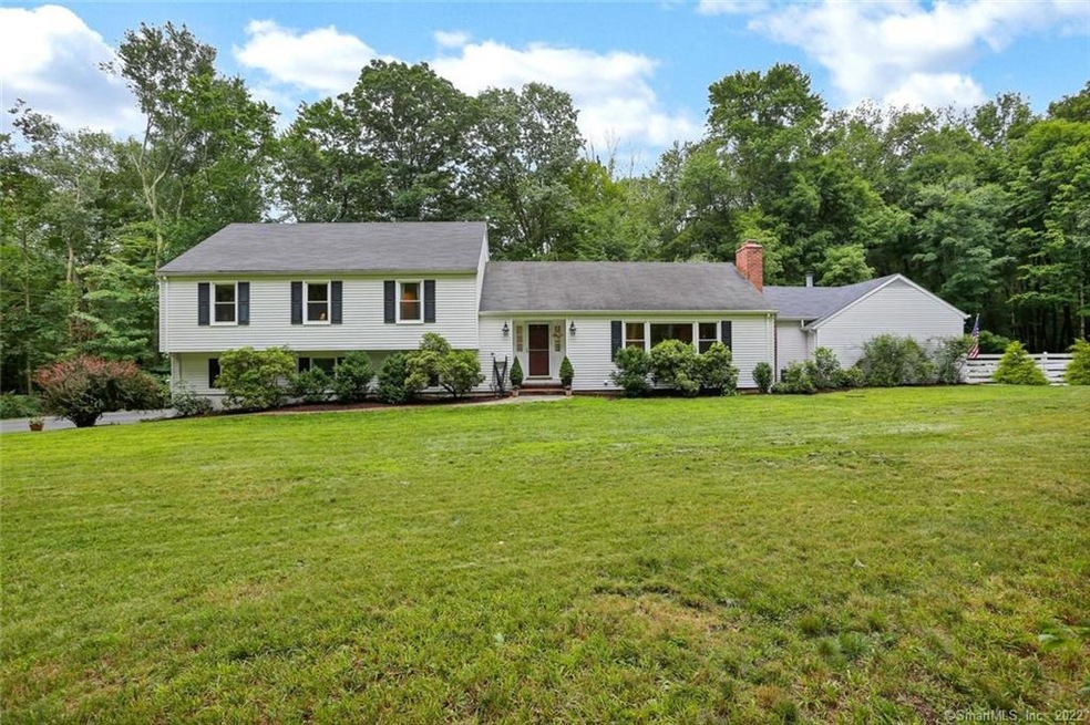 Spacious Greenfield Hill Colonial/Split abuts cul-